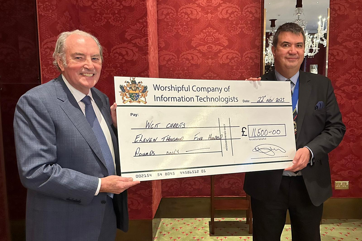 Stefan Fafinski receiving a cheque from John O'Connell from the 2023 Enterprise Awards.